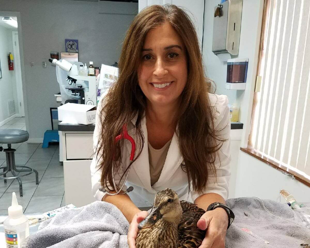 Dr. Jacki Love caring for a duck